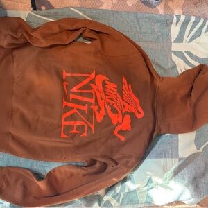 Nike Hoodie in Brown with Vibrant Orange Graphic